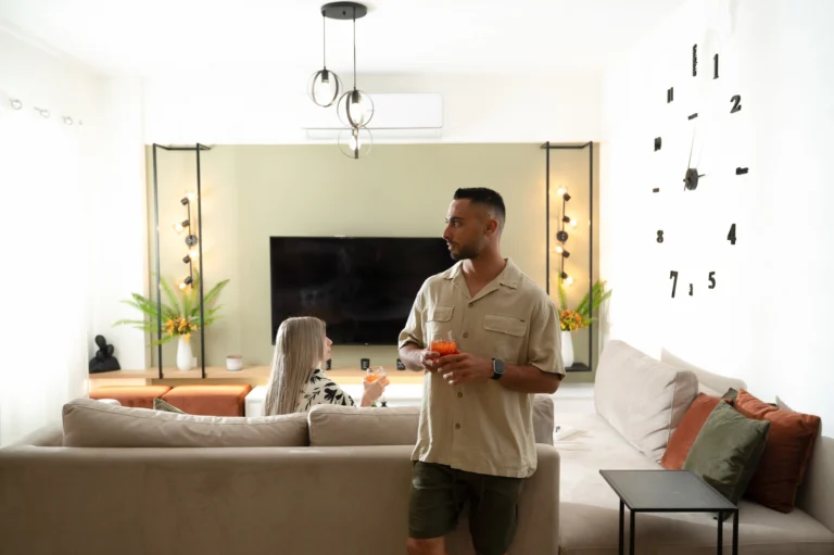 Modern living room with TV showing Netflix at Ria's Apartment in Agios Nikolaos, featuring stylish decor.